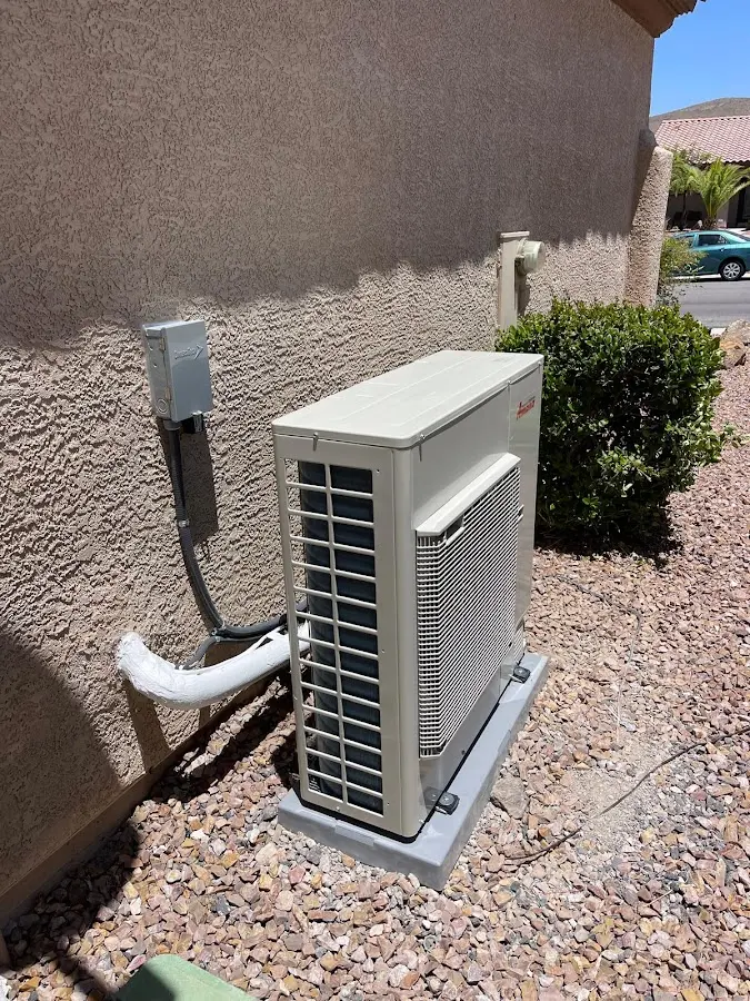 Residential air conditioning condenser unit in McCalla